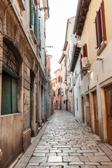Fototapeta na wymiar 2019, Europe, Croatia, Rovinj. Architecture of old town, lonely narrow street of Rovinj. Travel, adventure concept. City background.