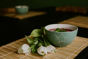 beetroot soup and white tulips © Julia