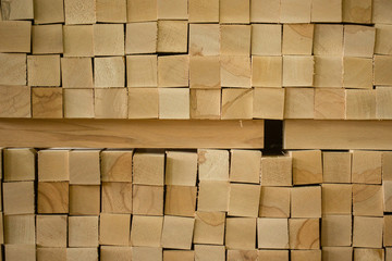 Wall of square wooden sticks stacked