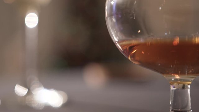 cognac in a glass goblet on a festive evening