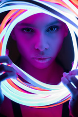 portrait of futuristic african american woman in neon lighting © LIGHTFIELD STUDIOS