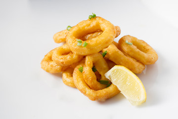 Fried squid on white table