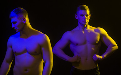 Strong men twins with abdominal strength, fit males with muscular six pack abs.