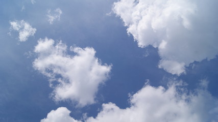 Obraz premium fluffy white clouds in the blue sky