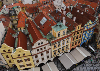 Red roofs of old medieval buildings in Old Town Square (Staromestske Namesti) seen from Old Town Hall in Staro Mesto, Prague, Czech Republic.