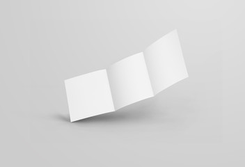 Mockup of a white blank open trifold, square standard booklet, with realistic shadows, isolated on background.