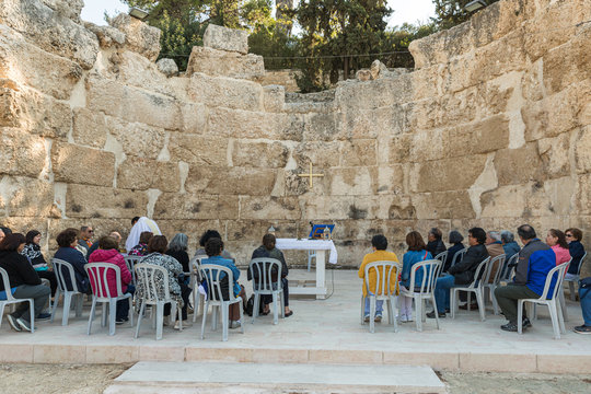 The priest makes a collective prayer on the ruins of the Byzantine church complex on the territory of Emmaus Nicopolis