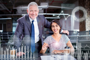 Portrait of smiling business leader and his financial assistant with virtual business diagrams....