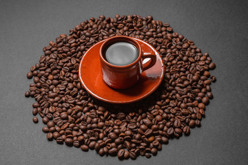 coffee mug on coffee beans