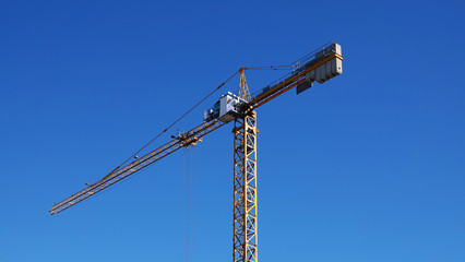 Tractors and excavators work on the construction of the foundation zero cycle