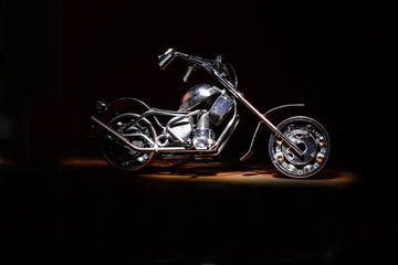 motorcycle on a black background under lighting