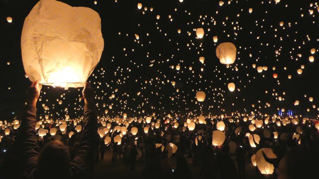 Crowd Releasing Lanterns At Festival