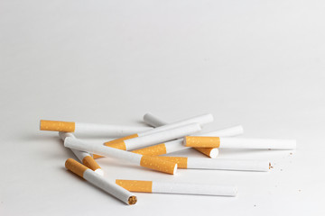 Cigarettes on a white background, tobacco is not a game
