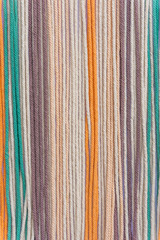 Colorful macrame threads texture closeup