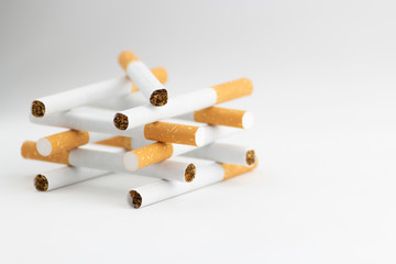 Cigarettes on a white background, tobacco is not a game