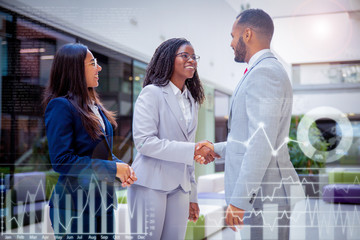 Happy diverse business partners greeting each other with virtual text samples and statistical...
