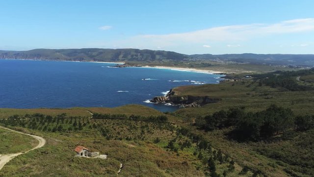 Aerial pull of hills coastline and vineyards of Cape Prior located near the chapel of Santa Comba