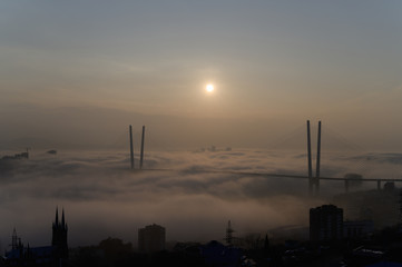 Fototapeta premium Vladivostok cityscape daylight view. Fog over the city.