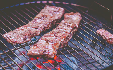 Grilled beef raw barbecue. Entrana Argentina (diaphragm) and bbq ribs at (home in quarantine for Covid-19). 