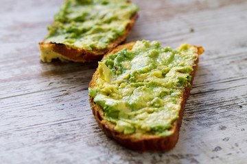 Mashed avocada and whole grain bread healthy toastes