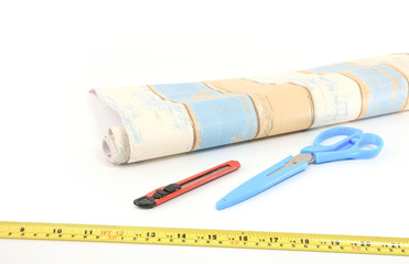 Tools used for wallpapering, renovation and repair on white background