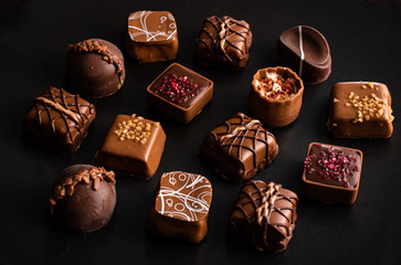 Chocolate assortment on dark background
