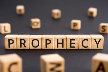 Prophecy - word from wooden blocks with letters, a prediction prophecy concept, random letters...