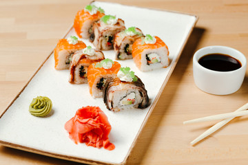 Sushi roll sett. Rice, nori, cream cheese, cucumber, fresh salmon, salmon roe, eel, sesame, unagi. Delivery food. Menu photo.