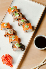 Sushi roll sett. Rice, nori, cream cheese, cucumber, fresh salmon, salmon roe, eel, sesame, unagi. Delivery food. Menu photo.