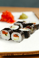 Japanese sushi roll set on delivery in quarantine. Red dragon. Rice, nori, tempura shrimp, tabasco sauce, cucumber, fresh salmon, salmon caviar.