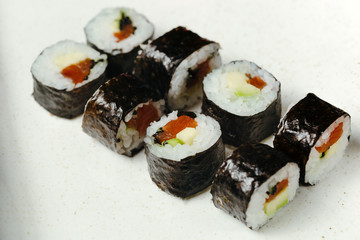 Japanese sushi roll set on delivery in quarantine. Red dragon. Rice, nori, tempura shrimp, tabasco sauce, cucumber, fresh salmon, salmon caviar.