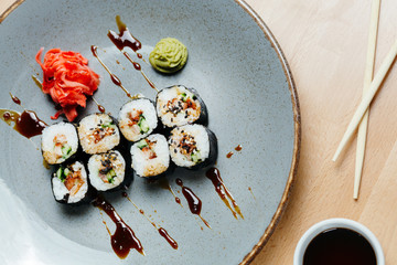 Sushi roll set poppies with eel. Rice, nori, eel, unagi, sesame. Japanese food. Delivery on quarantine.