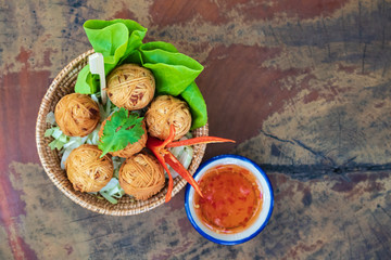 Deep fried wrapped pork with noodle, traditional thai food