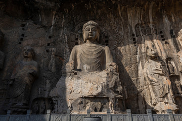 Fototapeta na wymiar Front view of Vairocana Buddha in Fengxian Temple, the biggest cave of Longmen grottoes, Luoyang, Henan, China