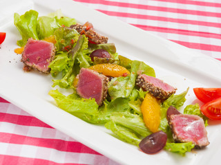 tasty salad with tuna orange and greens