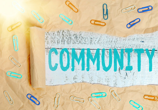 Conceptual hand writing showing Community. Concept meaning group of showing with a common characteristics living together