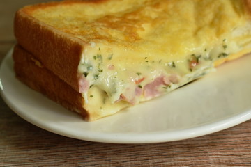 French toast sandwich stuffed bacon and cheese on plate 