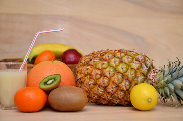 beautiful still life with tropical fruits and a glass of juice