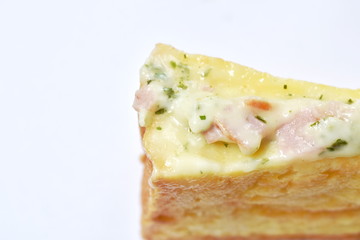 French toast sandwich stuffed bacon and cheese on white background