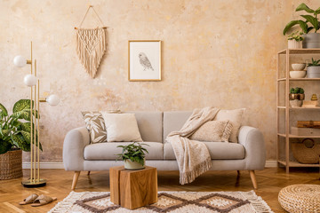 Stylish scandi compostion at living room interior with design gray sofa, wooden coffee table,...