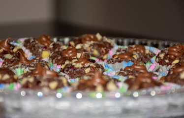 Delicious chocolate cookies with nuts and cream filling