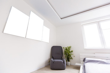 Mockup photo canvas in interior. Empty canvas for design. White brick wall on background.