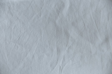 Fototapeta na wymiar crumpled white cotton texture close up