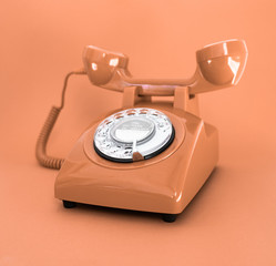 vintage brown phone on smooth brown background