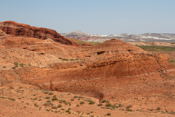 Fototapeta na wymiar Colored, layered mountains of Aktau in the reserve of Kazakhstan.