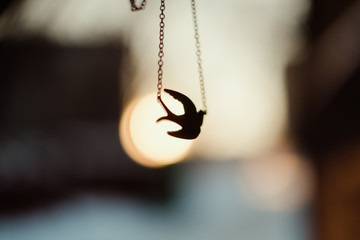 pendant in the form of a bird tit on a chain