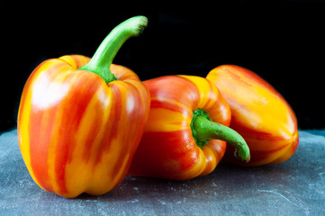 Flame bell pepper on a dark slate background
