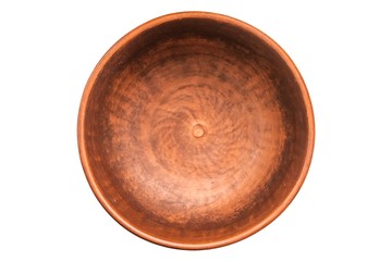 Clay bowl isolated on white. Closeup of a clay bowl, top view.