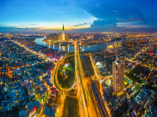 Top view aerial of center Ho Chi Minh City and Saigon bridge with development buildings, transportation, energy power infrastructure. Financial and business centers in  Vietnam. View from District 2