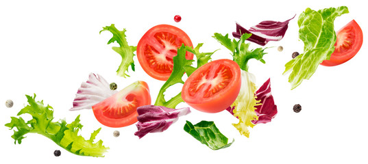 Falling salad of leaves with rucola, lettuce, radicchio, romano green frize and tomatoes